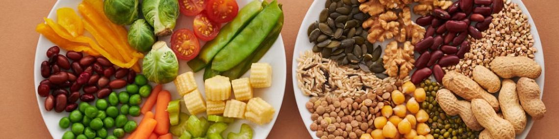 A vibrant flatlay of colorful vegetables and nuts showcasing a balanced diet concept.